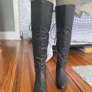 Thigh high black leather boots